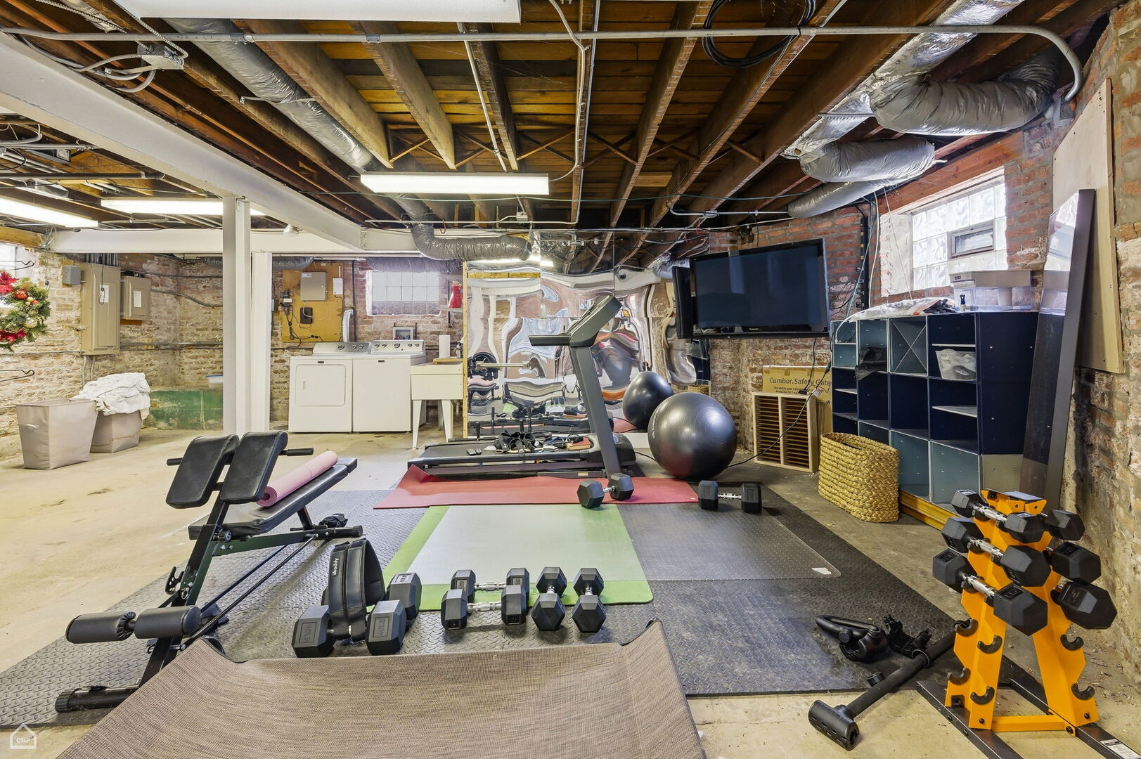 1516 West Sherwin Avenue Chicago, IL 60626 - Photo 36 of 45 a room with lots of gym equipment