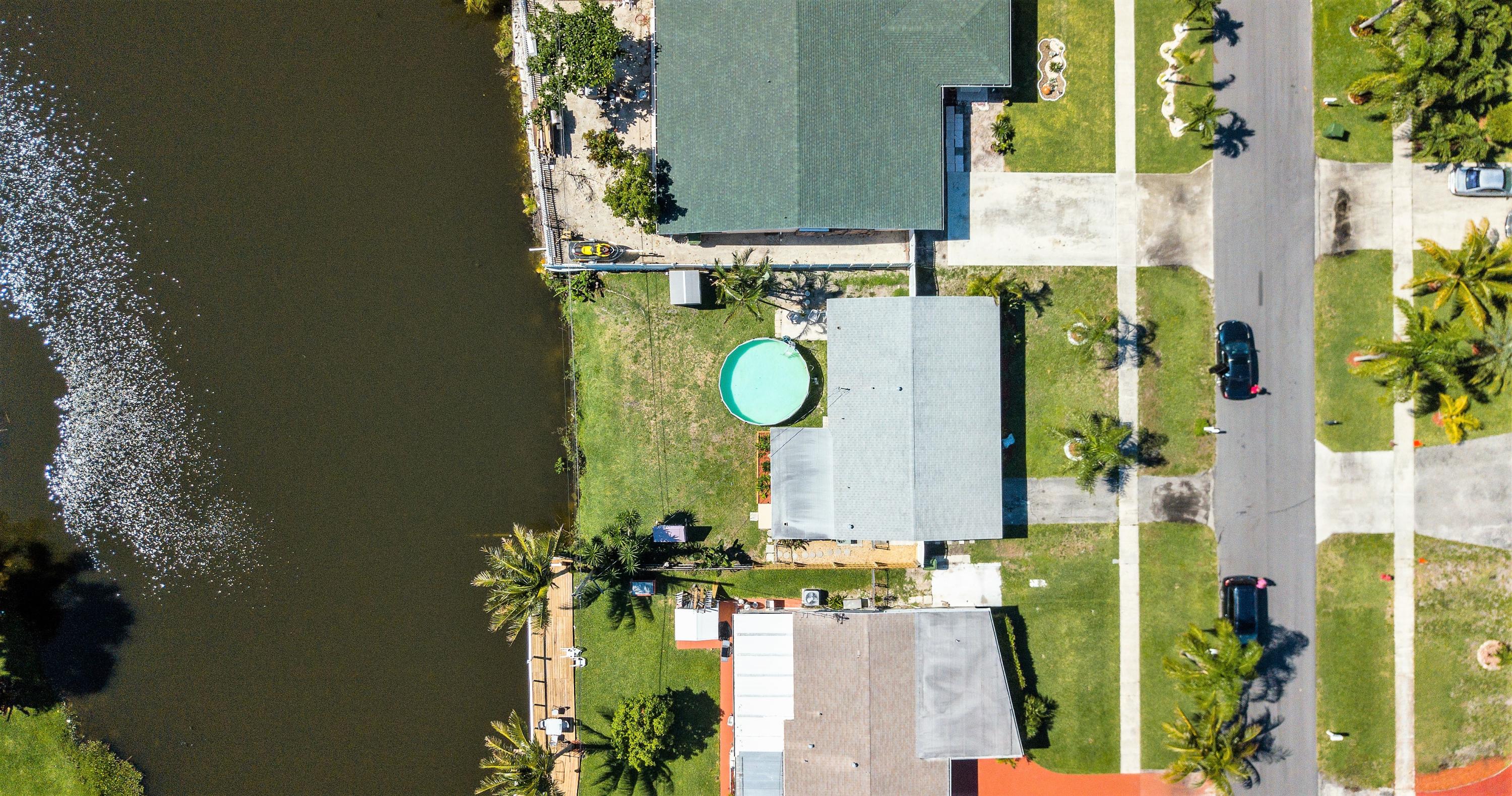 46 Andros Road Palm Springs, FL 33461 - Photo 25 of 25 Aerial view of property and lake