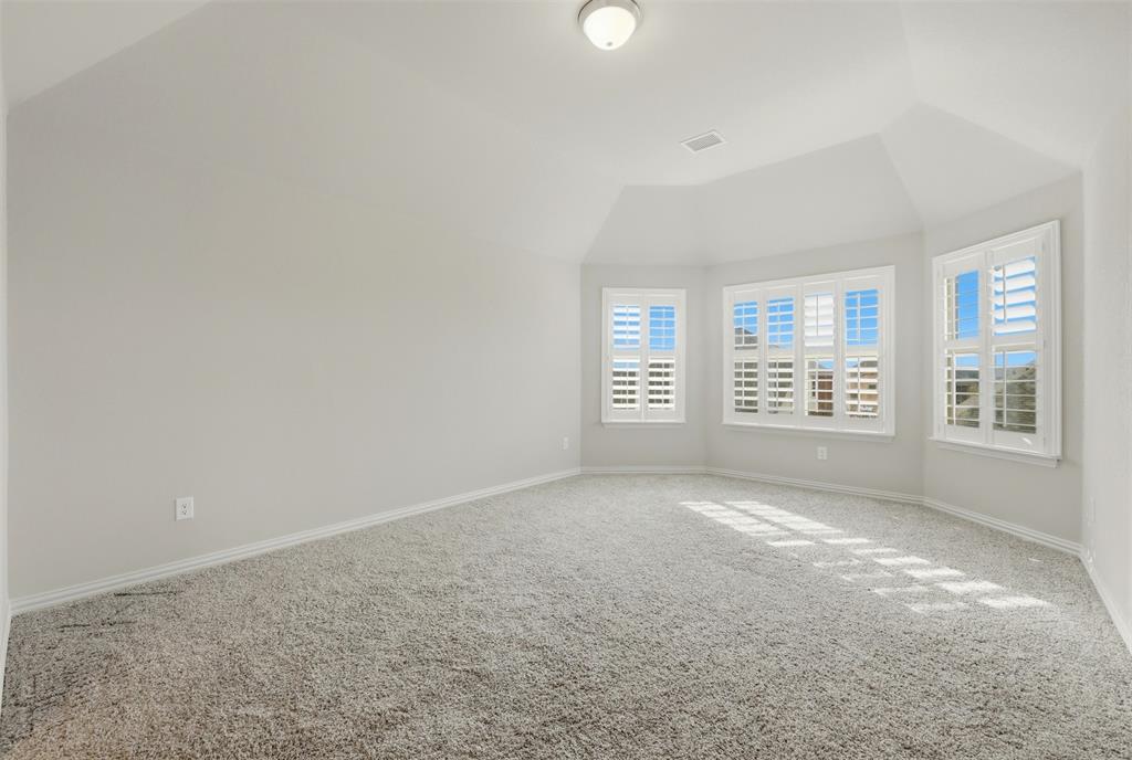 418 Crestview Drive Midlothian, TX 76065 - Photo 24 of 39 Third Bedroom with lofted ceiling and baseboards