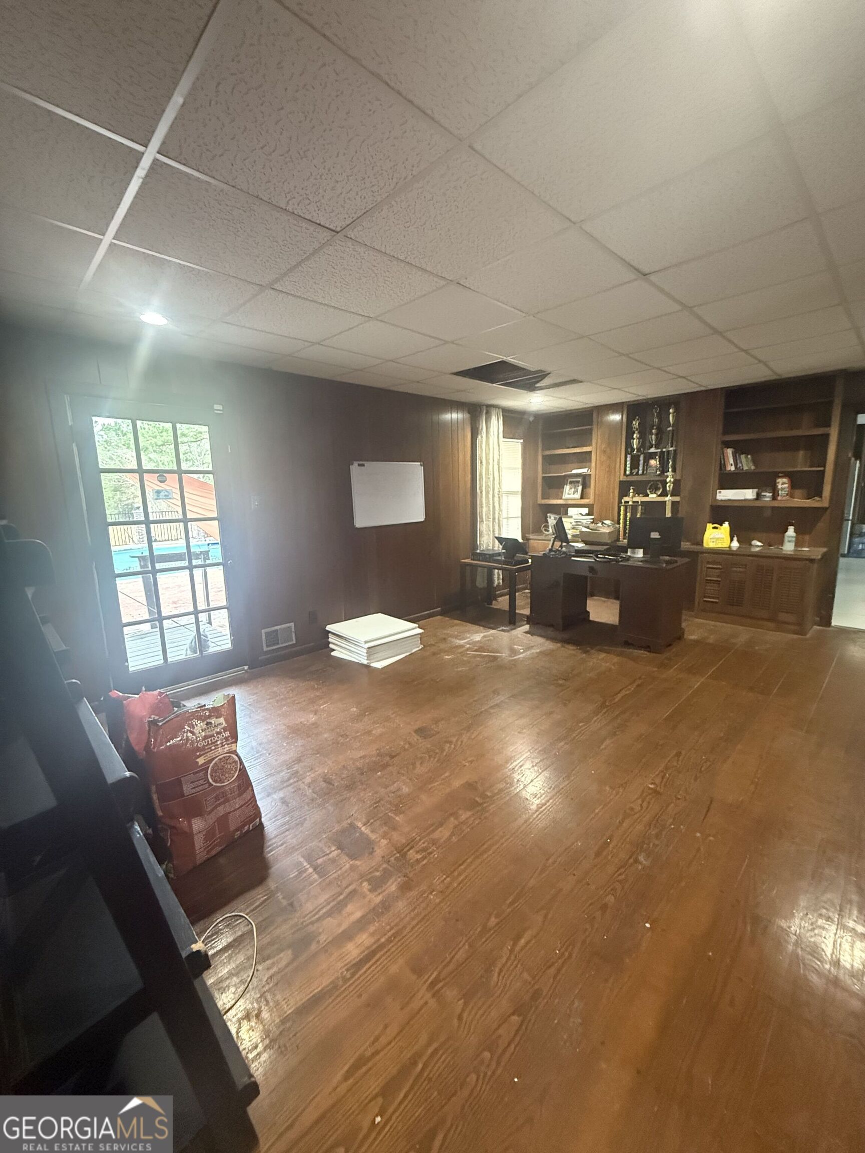 3861 Newnan Road Griffin, GA 30223 - Photo 44 of 89 a bedroom with a bed window and couch