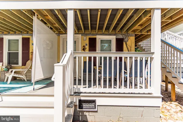 a view of a house with wooden fence
