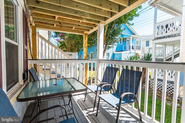 a balcony view with a seating space