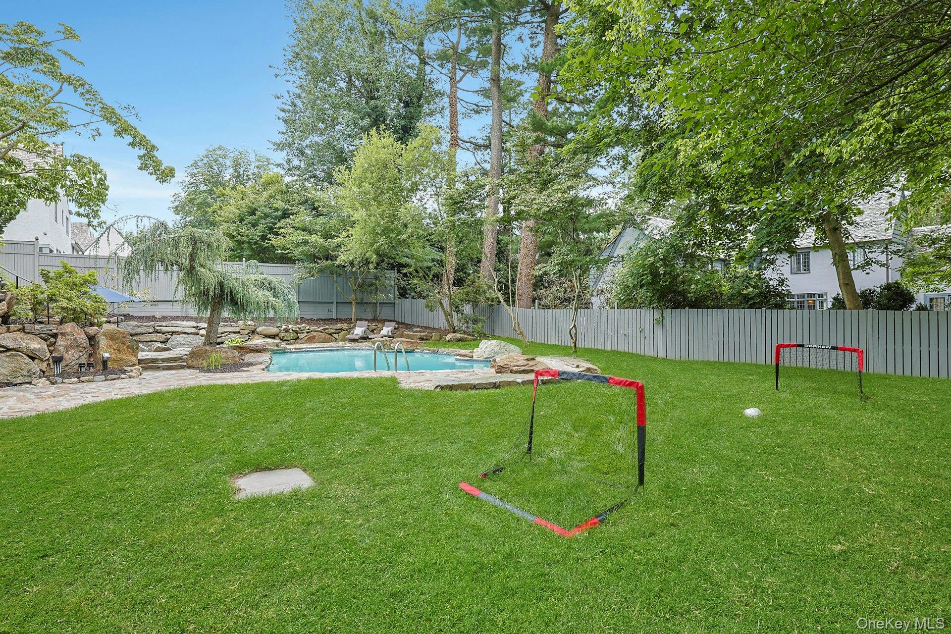 14 Withington Road Scarsdale, NY 10583 - Photo 36 of 41 a view of a park with swings