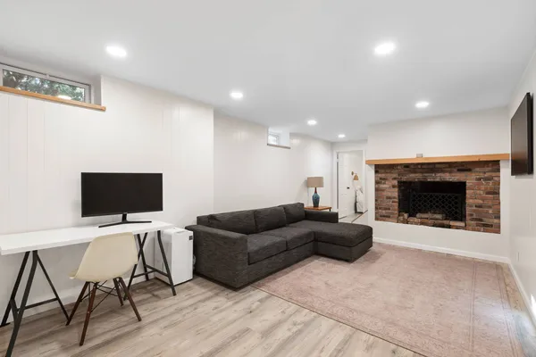 a living room with furniture and a fireplace