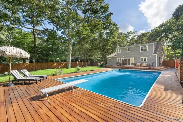 a view of swimming pool with lounge chair
