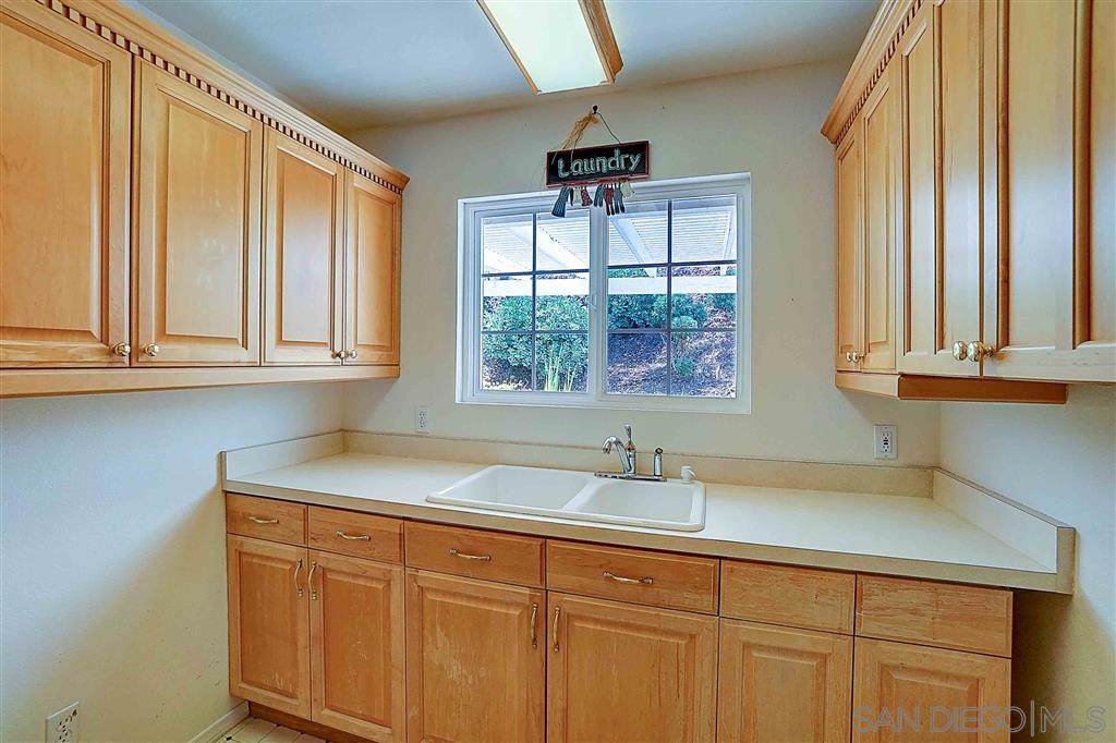 15375 Woods Valley Road Valley Center, CA 92082 - Photo 6 of 24 Spacious laundry with lots of storage