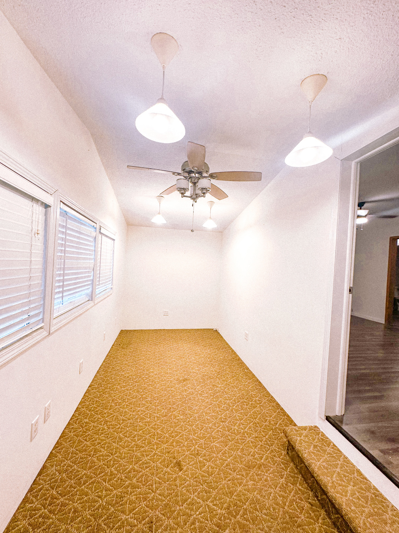 4920 Mt Moriah Road Galatia, IL 62935 - Photo 17 of 33 a view of a room with a chandelier fan and wooden floor