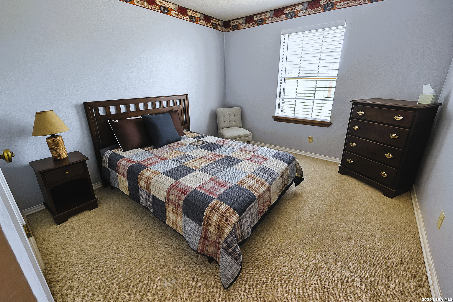 799 County Road 6612 Devine, TX 78016 - Photo 23 of 32 a bedroom with a bed and window