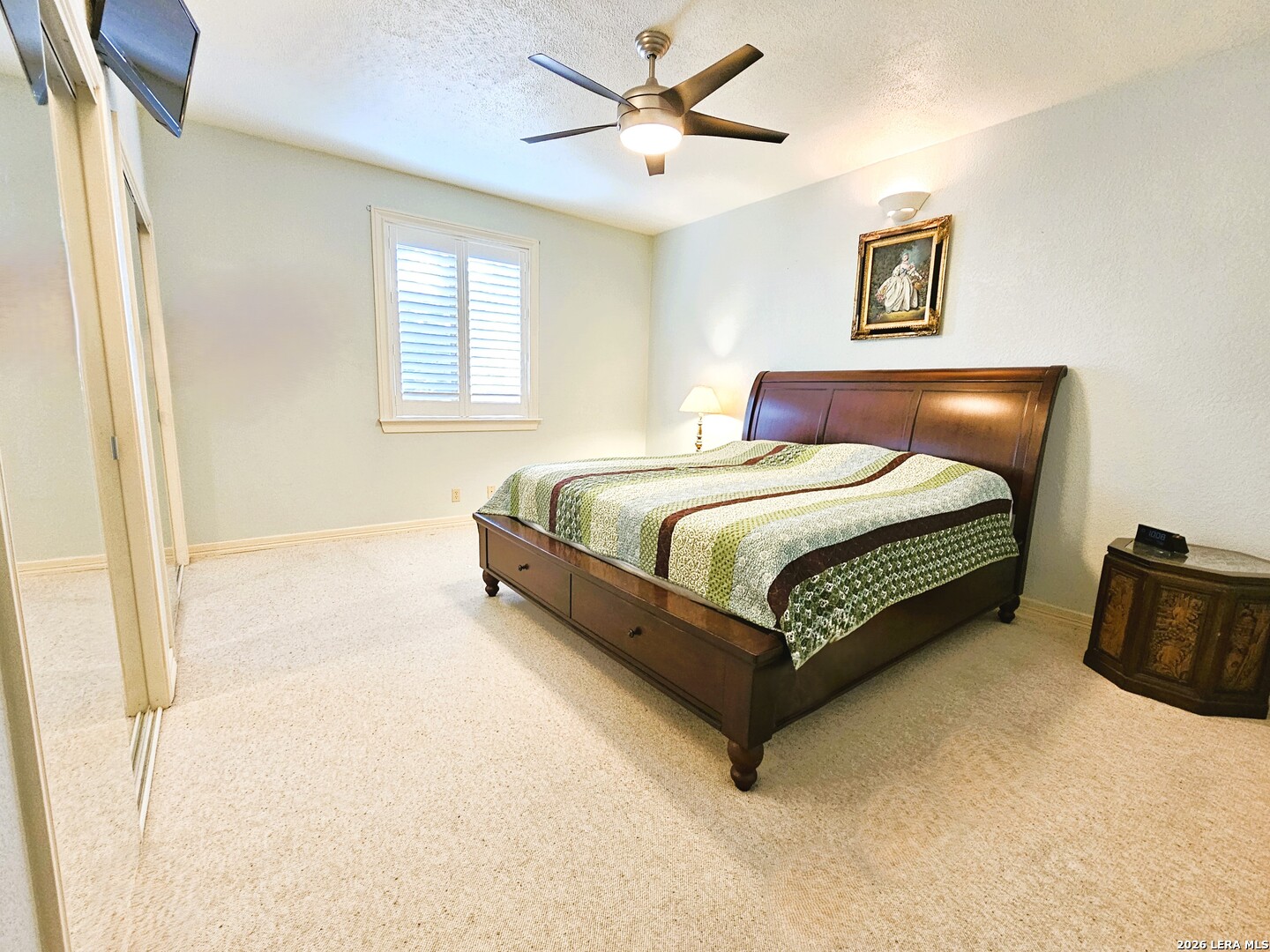 799 County Road 6612 Devine, TX 78016 - Photo 7 of 32 a bed sitting in a bedroom next to a window