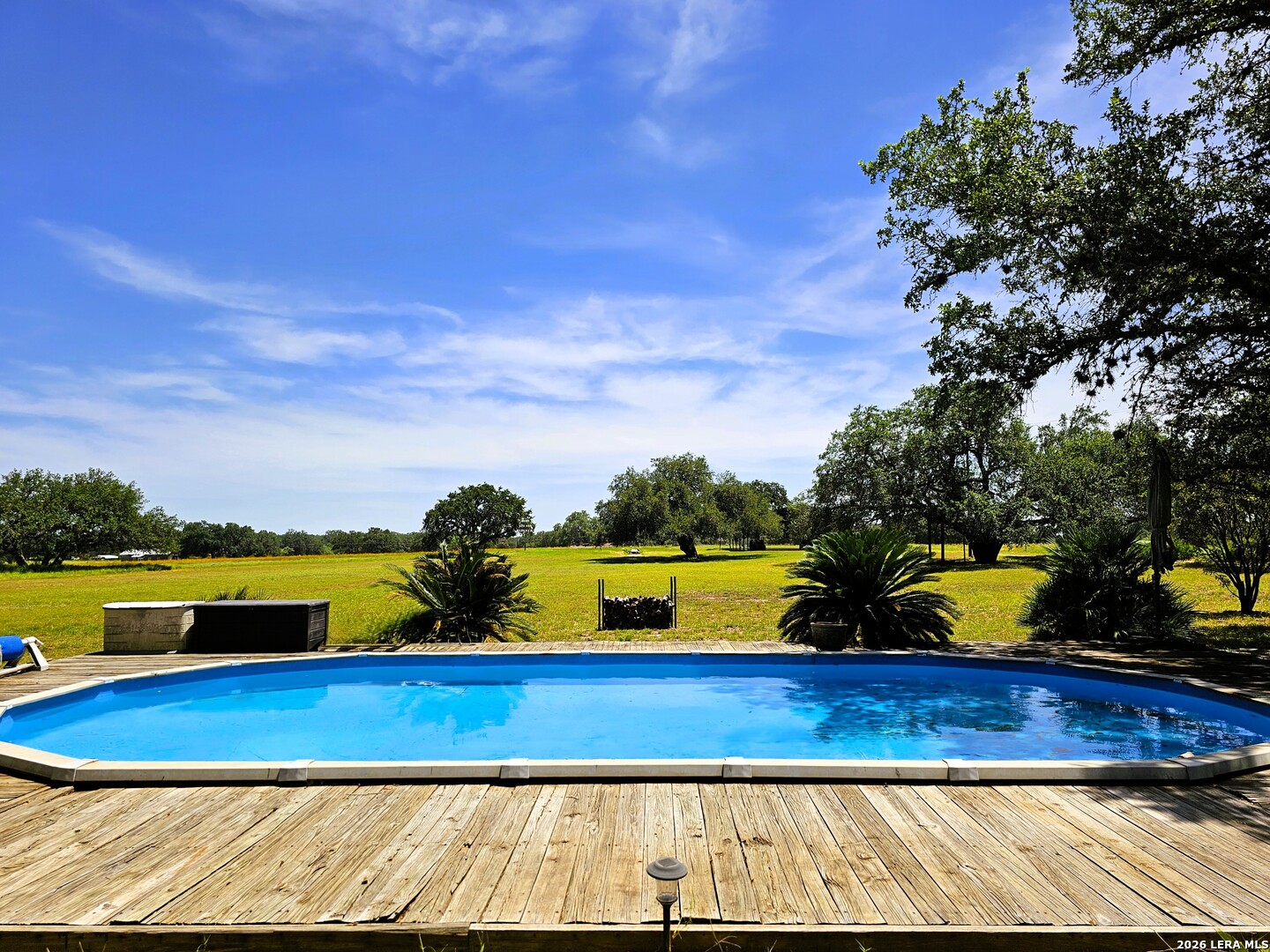 799 County Road 6612 Devine, TX 78016 - Photo 10 of 32 a view of swimming pool with outdoor seating