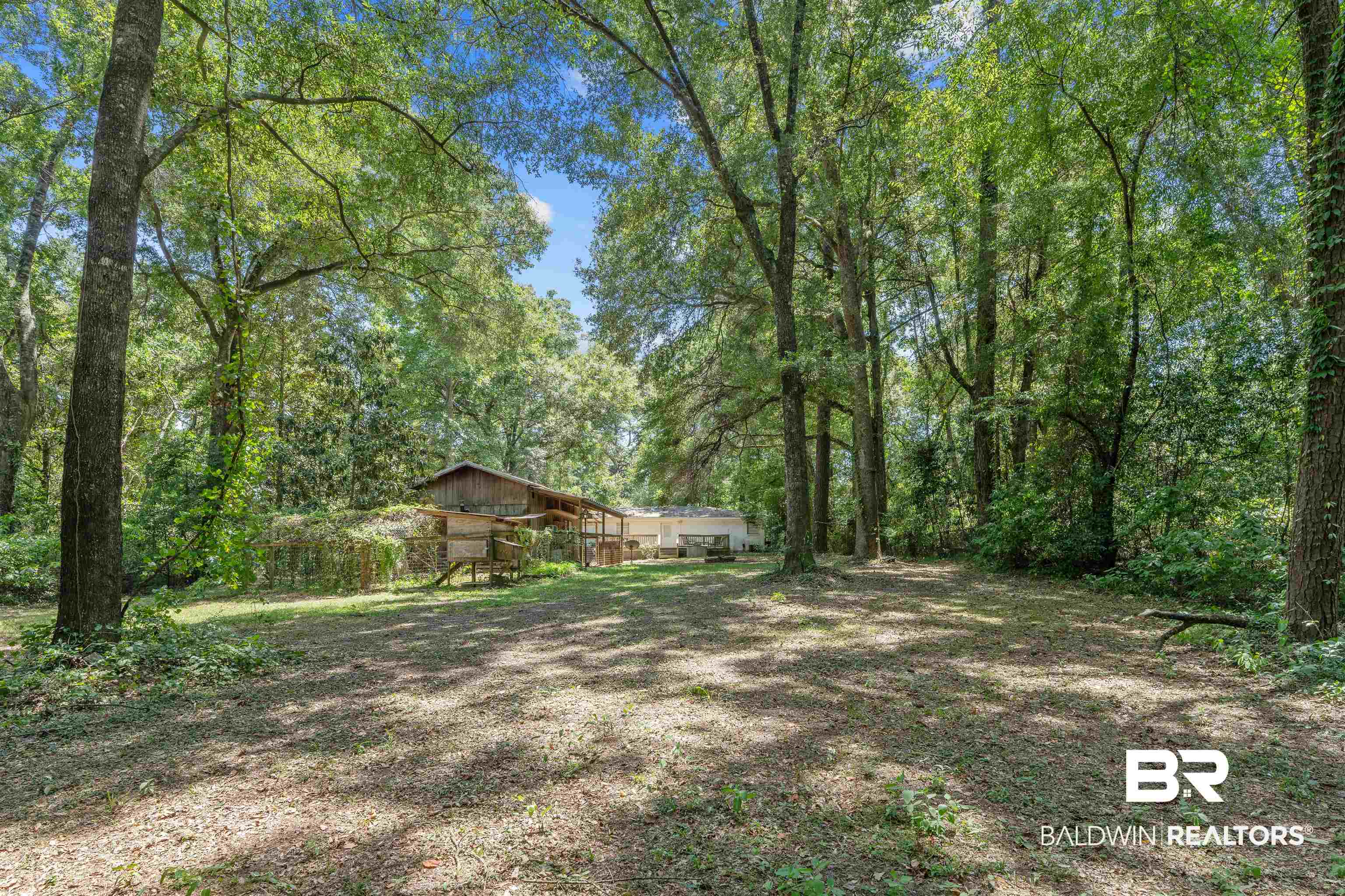 922 Dauphine Circle Daphne, AL 36526 - Photo 20 of 29 View of yard with a wooded view