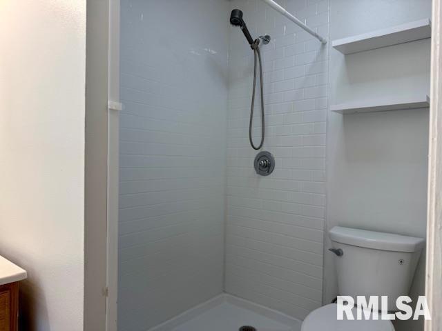 765 9th Avenue South Clinton, IA 52732 - Photo 14 of 25 a bathroom with a shower toilet and sink