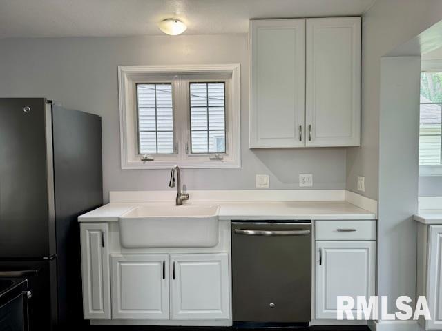 765 9th Avenue South Clinton, IA 52732 - Photo 2 of 25 a kitchen with stainless steel appliances granite countertop a sink stove and refrigerator