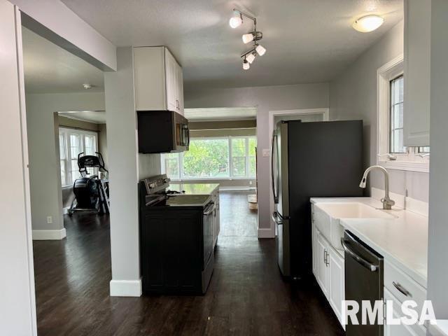 765 9th Avenue South Clinton, IA 52732 - Photo 4 of 25 a kitchen with a refrigerator and a stove top oven