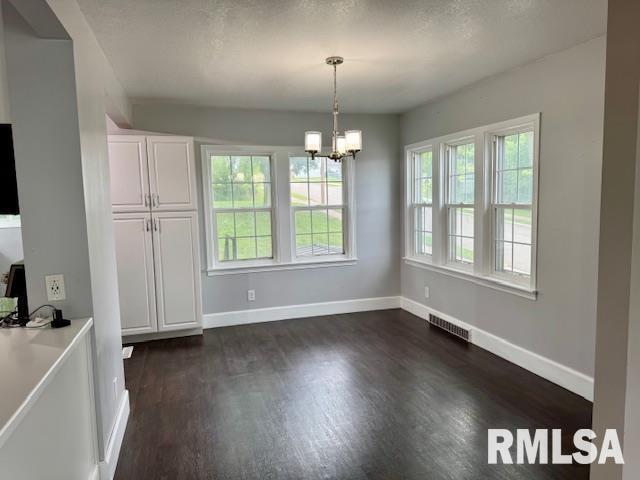 765 9th Avenue South Clinton, IA 52732 - Photo 5 of 25 an empty room with wooden floor and windows