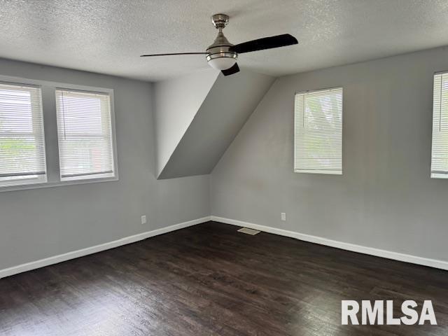 765 9th Avenue South Clinton, IA 52732 - Photo 10 of 25 an empty room with wooden floor fan and windows