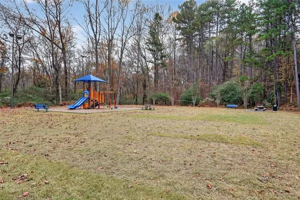 a view of outdoor space with garden and trees