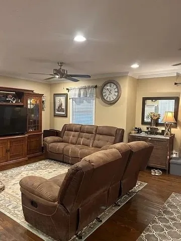 a living room with a couch and a flat screen tv