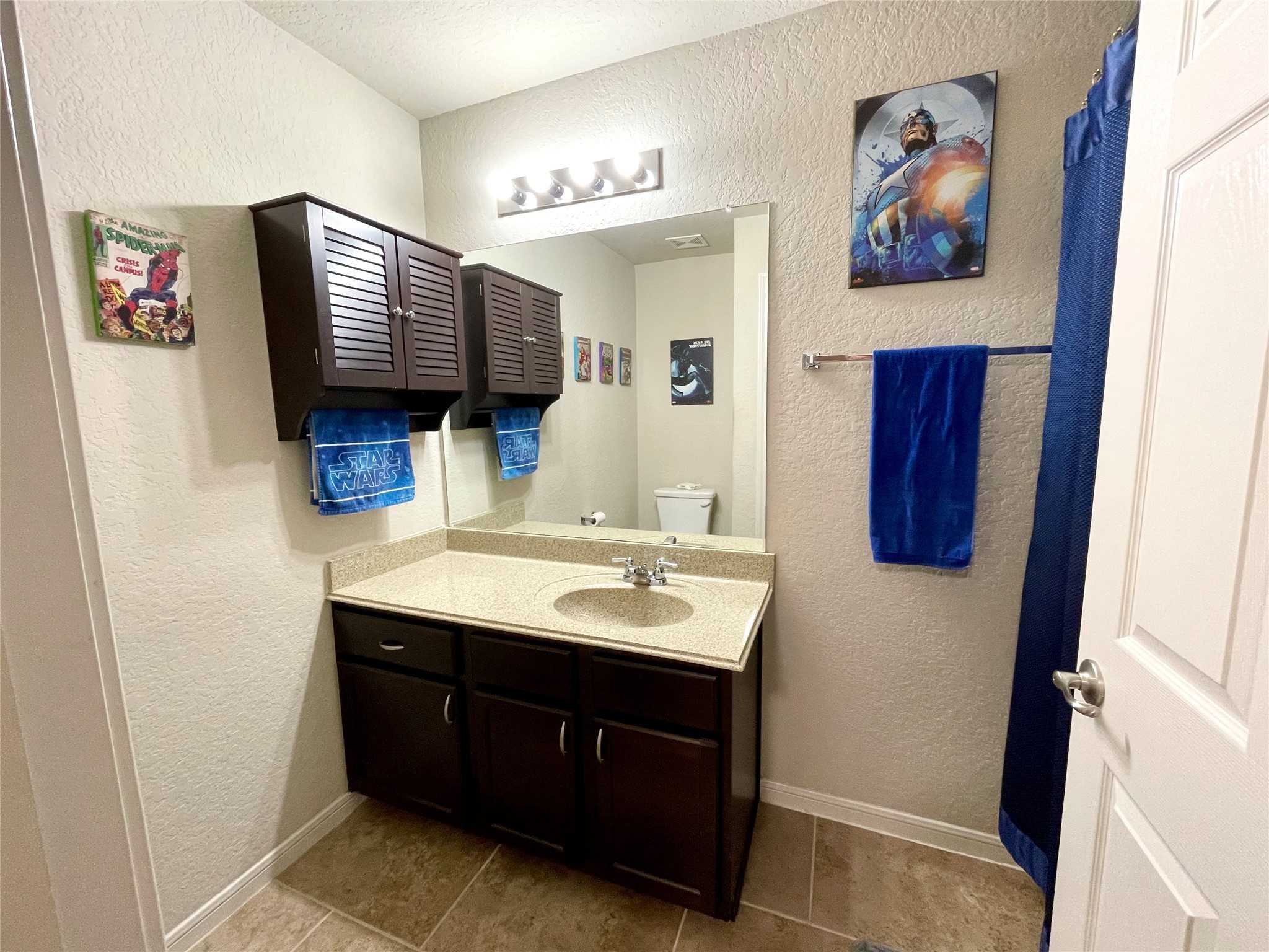 153 Citori Path New Braunfels, TX 78130 - Photo 11 of 12 a bathroom with a sink a mirror and glass door