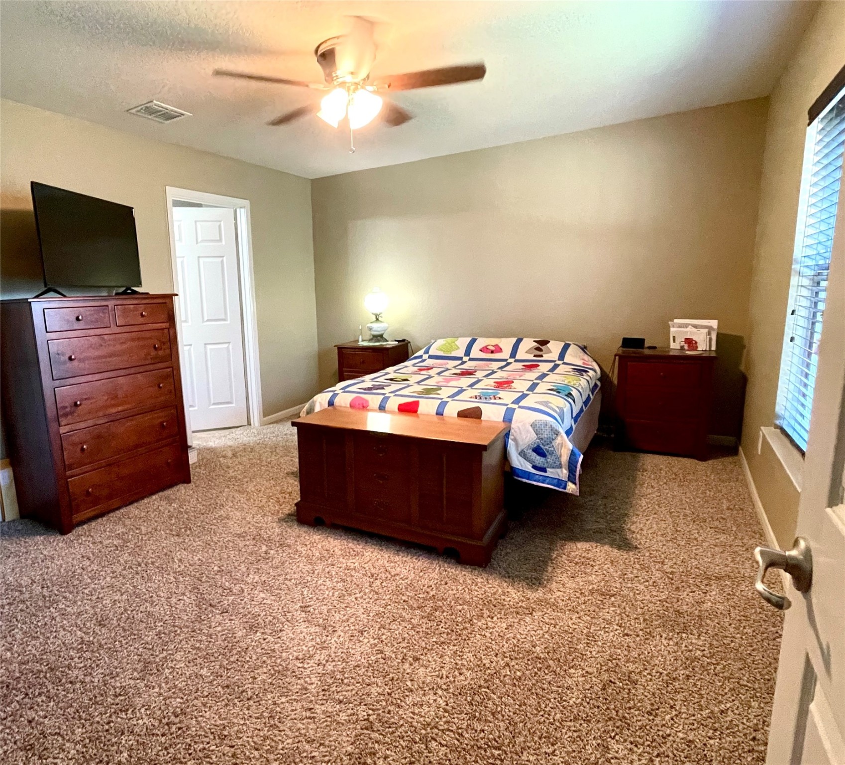 153 Citori Path New Braunfels, TX 78130 - Photo 7 of 12 a bedroom with a bed and a flat screen tv