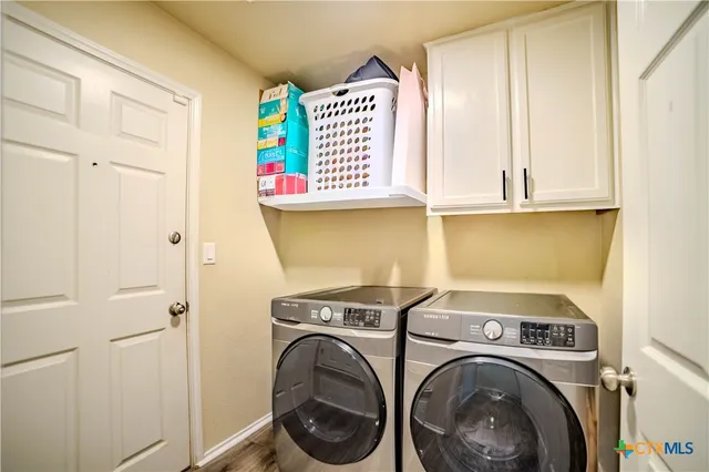 a utility room with dryer and washer
