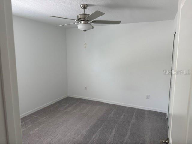 6259 Back Forty Loop Zephyrhills, FL 33541 - Photo 17 of 22 an empty room with a fan & a window