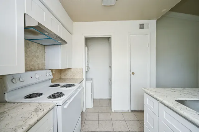 a kitchen with a sink a stove and refrigerator