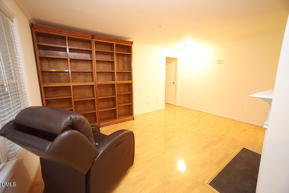 3161 Hemlock Forest Circle, Unit 101 Raleigh, NC 27612 - Photo 7 of 21 a living room with furniture and a window