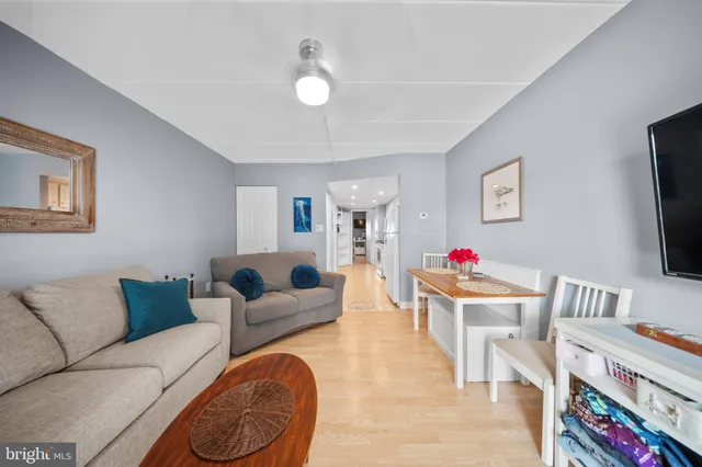 a kitchen with stainless steel appliances granite countertop a sink stove refrigerator and cabinets