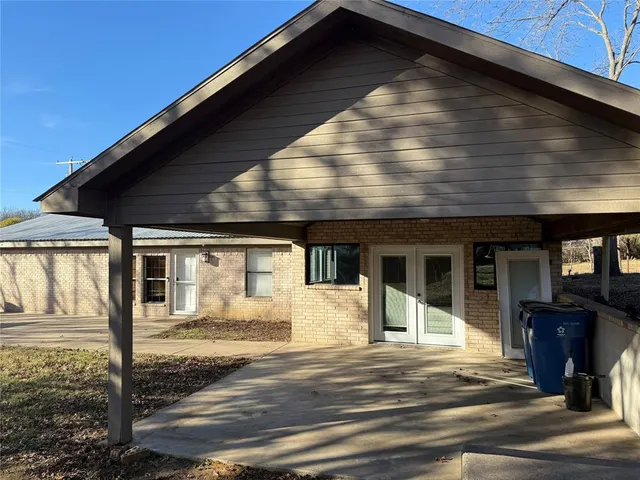 a view of a house with wooden walls
