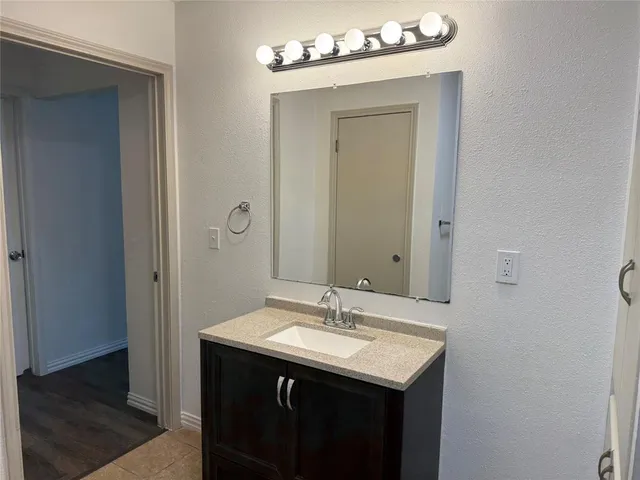 a view of a bathroom from the hallway