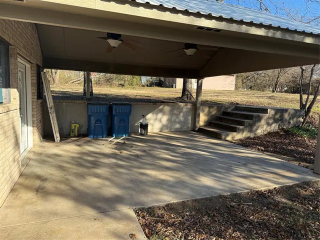 a view of a yard with large trees