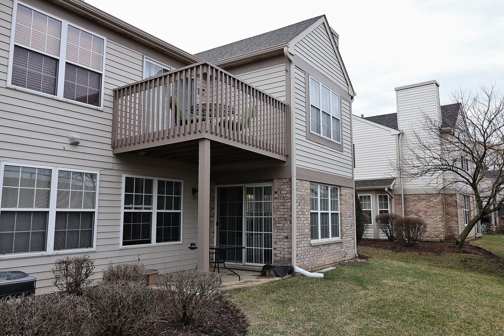 1982 Gary Court, Unit A Schaumburg, IL 60193 - Photo 18 of 21 a front view of a house with a garden