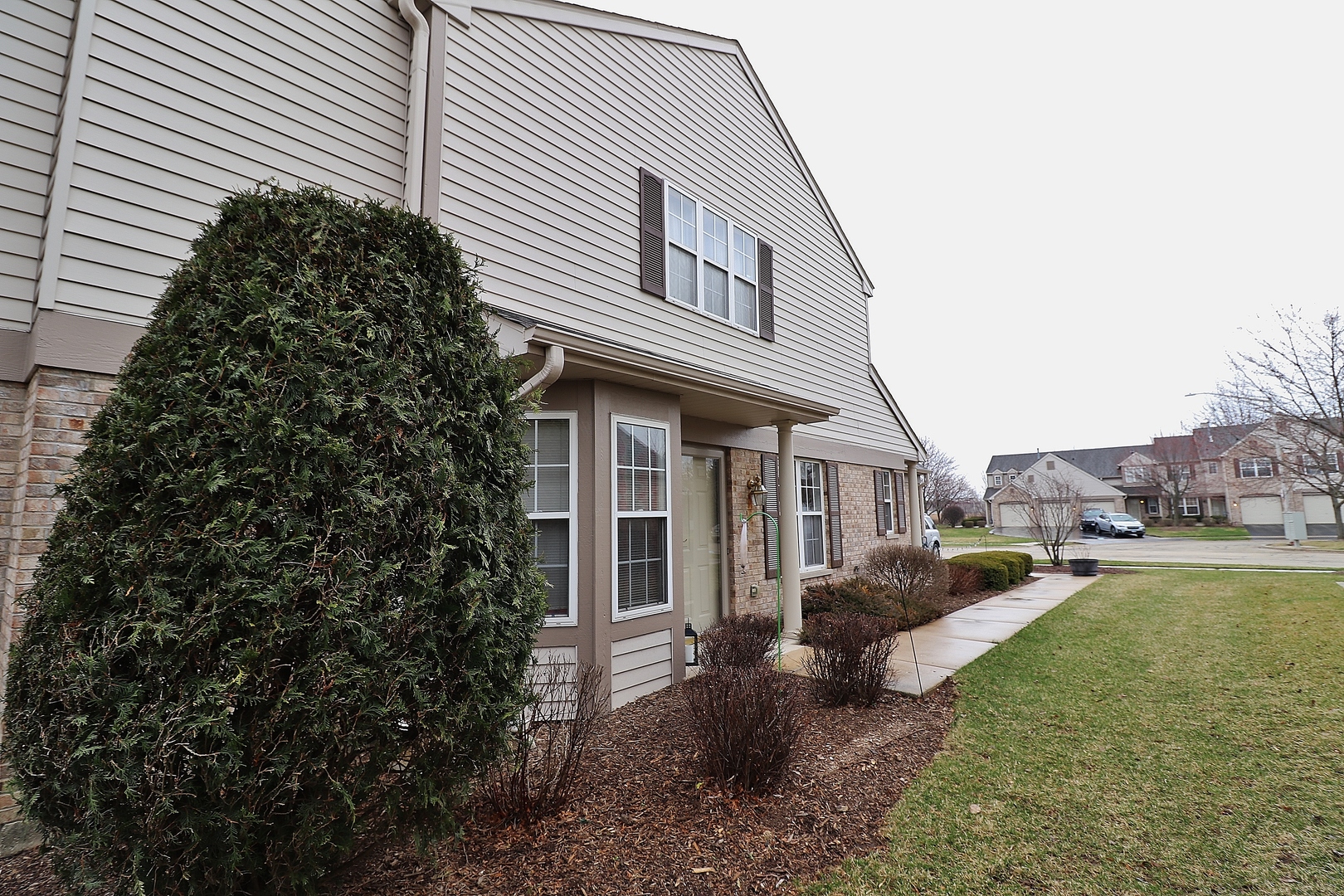 1982 Gary Court, Unit A Schaumburg, IL 60193 - Photo 20 of 21 a front view of a house with garden