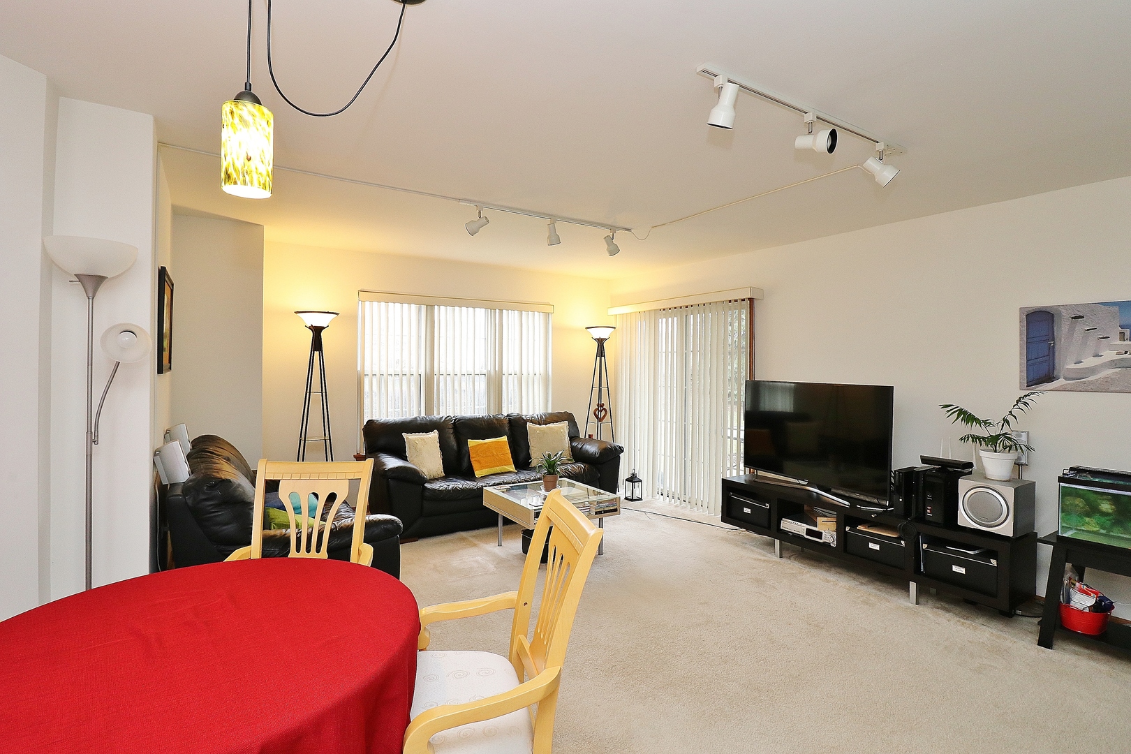 1982 Gary Court, Unit A Schaumburg, IL 60193 - Photo 4 of 21 a view of a livingroom with furniture and a flat screen tv