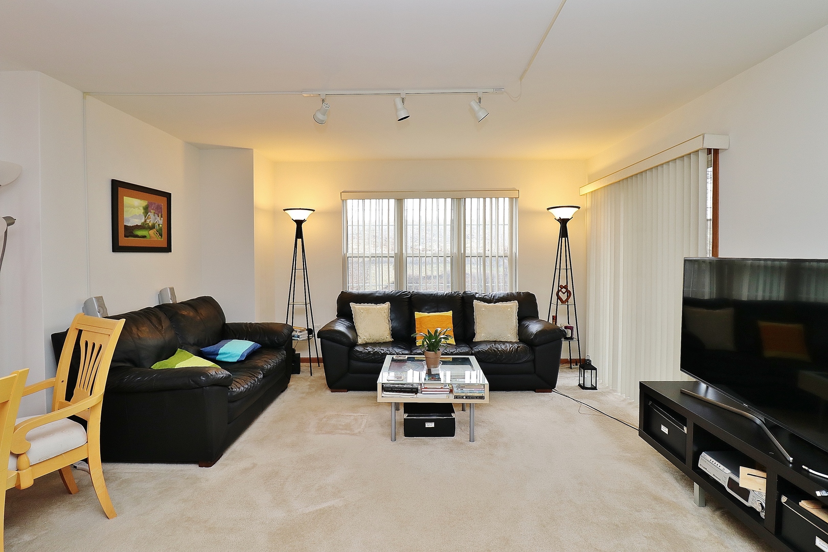 1982 Gary Court, Unit A Schaumburg, IL 60193 - Photo 6 of 21 a living room with furniture and a flat screen tv