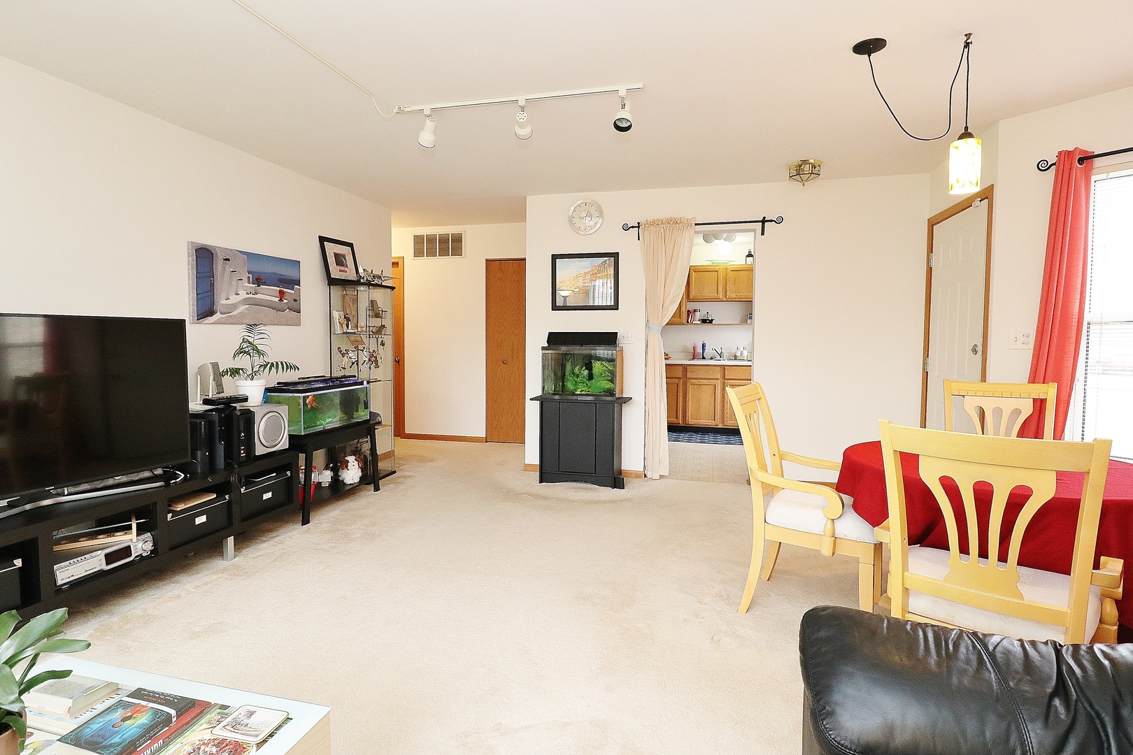 1982 Gary Court, Unit A Schaumburg, IL 60193 - Photo 8 of 21 a living room with furniture and a flat screen tv