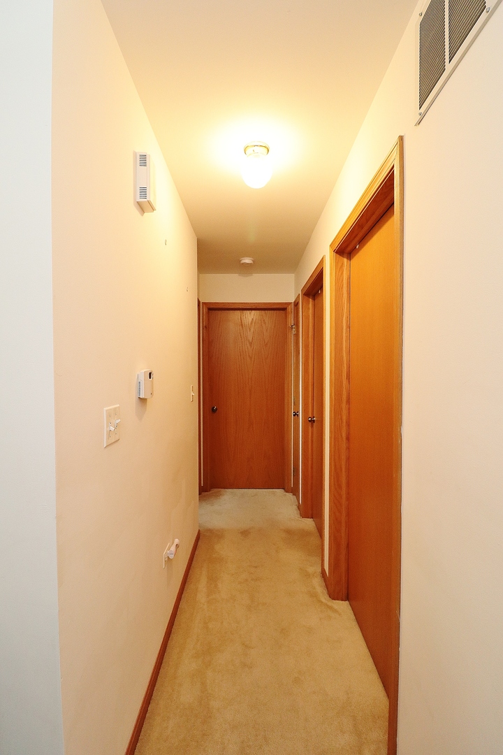 1982 Gary Court, Unit A Schaumburg, IL 60193 - Photo 10 of 21 a view of a hallway