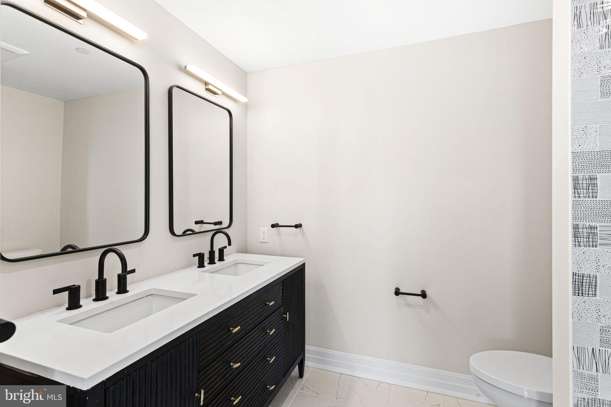 151 Kings Highway East, Unit B Haddonfield, NJ 08033 - Photo 11 of 23 a bathroom with a sink and a mirror