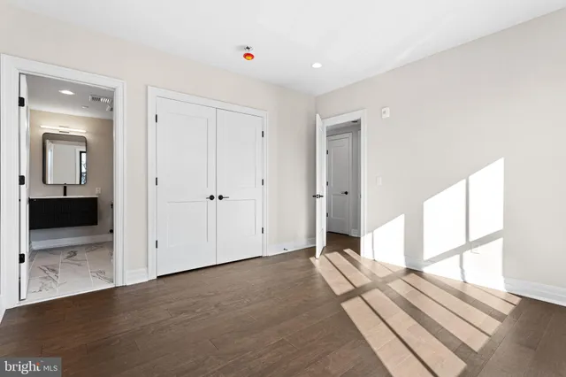 a bathroom with a bathtub sink mirror and toilet