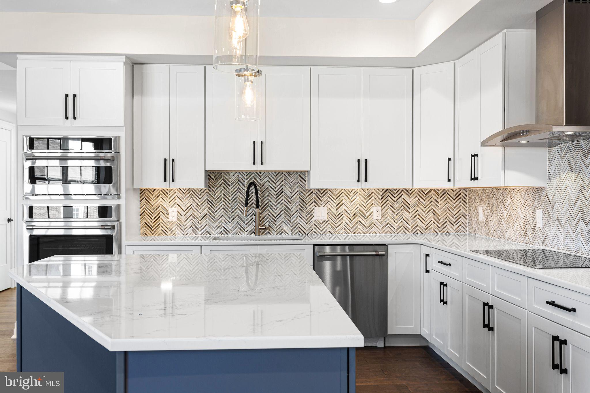 151 Kings Highway East, Unit B Haddonfield, NJ 08033 - Photo 7 of 23 a kitchen with stainless steel appliances granite countertop a sink and white cabinets