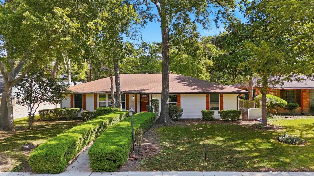 5940 Hunters View Lane Dallas, TX 75232 - Photo 2 of 24 Single story home featuring brick siding, a front lawn, and a shingled roof