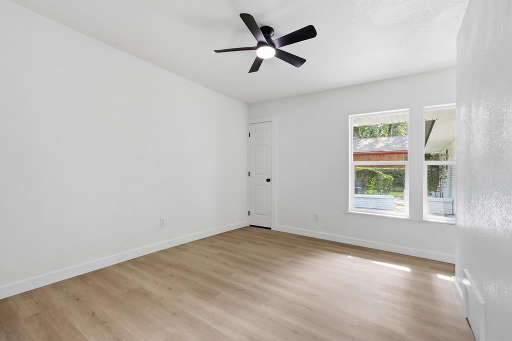 5940 Hunters View Lane Dallas, TX 75232 - Photo 8 of 24 Spare room with light wood-type flooring and a ceiling fan