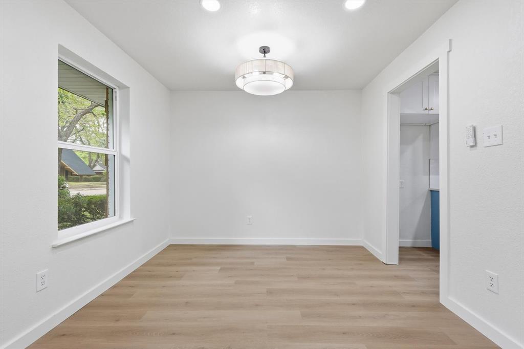 5940 Hunters View Lane Dallas, TX 75232 - Photo 9 of 24 Unfurnished dining area featuring light wood-type flooring and recessed lighting