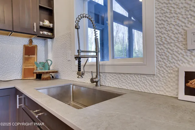 a bathroom with a sink double vanity and a mirror