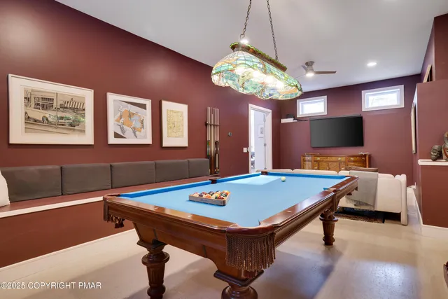 a living room with furniture a rug and a large window