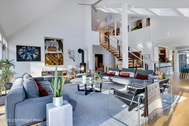 a bedroom with furniture and a wooden floor