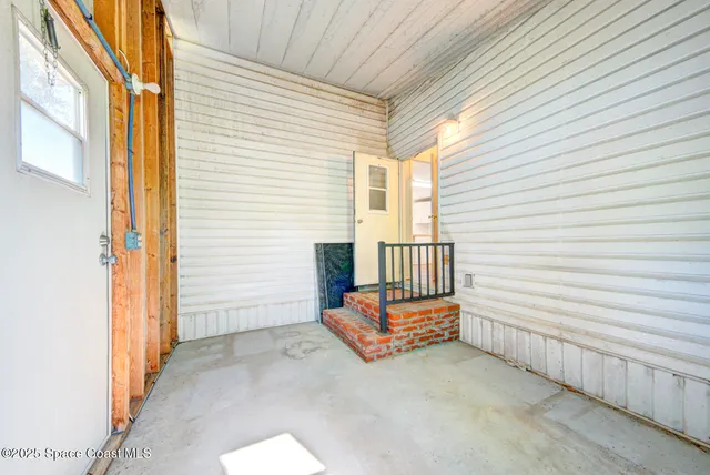 a view of a porch with a bench