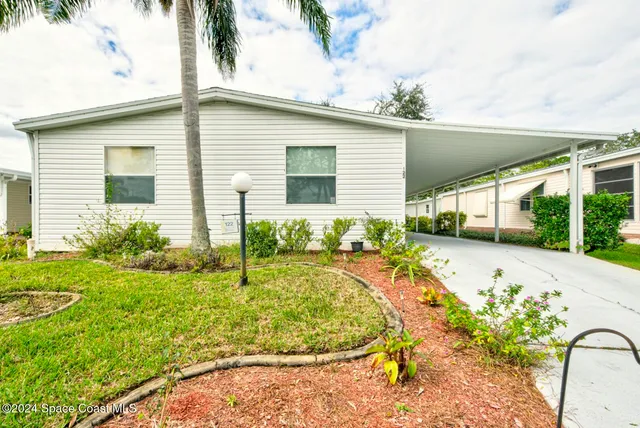a view of a backyard with a patio
