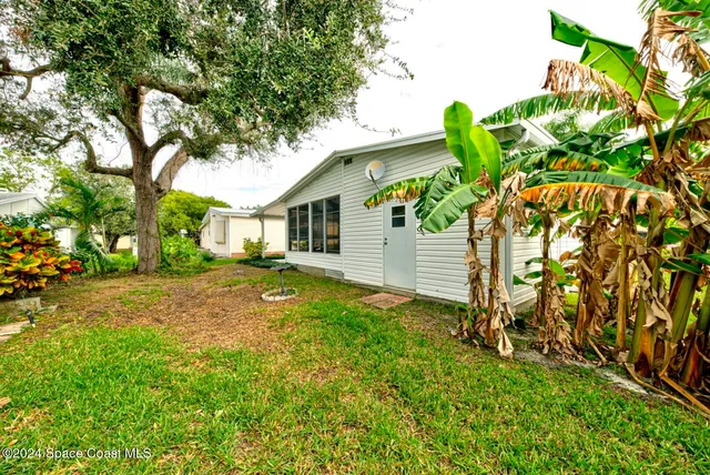 a backyard of a house with lots of green space